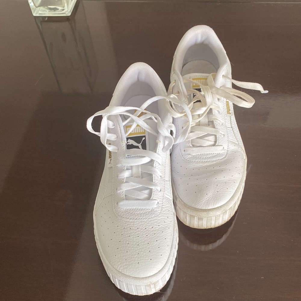 Puma white running shoes . Sprained ankle so one foot has been never worn !